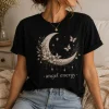 Woman wearing black Angel Energy celestial t-shirt with crescent moon, flowers and butterflies — PrintMyVibe Toronto