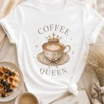 Vintage Coffee Queen print close-up - crown and latte art detail on white tee