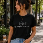 Woman wearing black My Comfort Creature dog line art t-shirt - PrintMyVibe Toronto