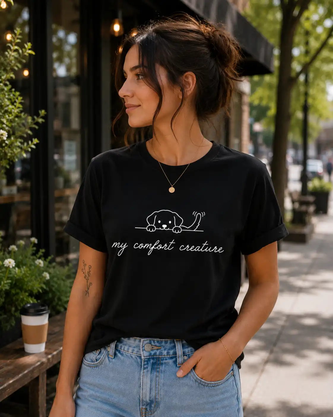 Woman wearing black My Comfort Creature dog line art t-shirt - PrintMyVibe Toronto