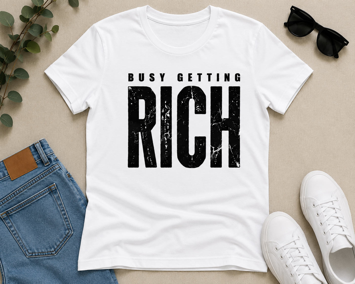 White Busy Getting Rich tee flat lay with jeans and sneakers - hustle tee Toronto