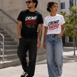 Couple in Crowd Energy tees walking downtown - unisex street tee pressed in Toronto