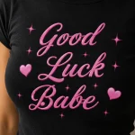 Good Luck Babe print close-up on black tee - pink script and hearts detail