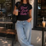 Good Luck Babe black fitted tee at a cafe - aesthetic women's top GTA