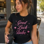 Woman wearing black Good Luck Babe fitted tee with pink script - PrintMyVibe Toronto