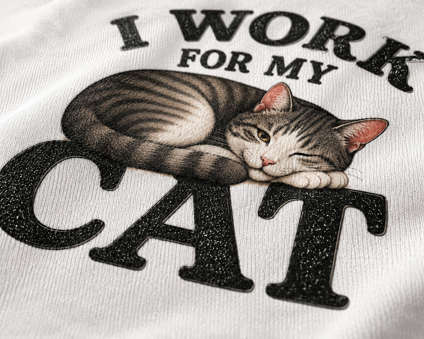I Work For My Cat design detail - sleepy tabby on bold lettering - PrintMyVibe Toronto