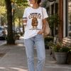 Woman in Running On Coffee tee outdoors - funny capybara coffee tee Canada