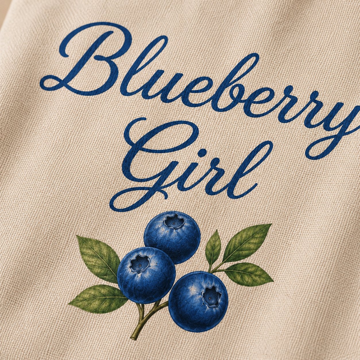 Blueberry Girl tote design close-up - navy script and hand-painted blueberries on canvas