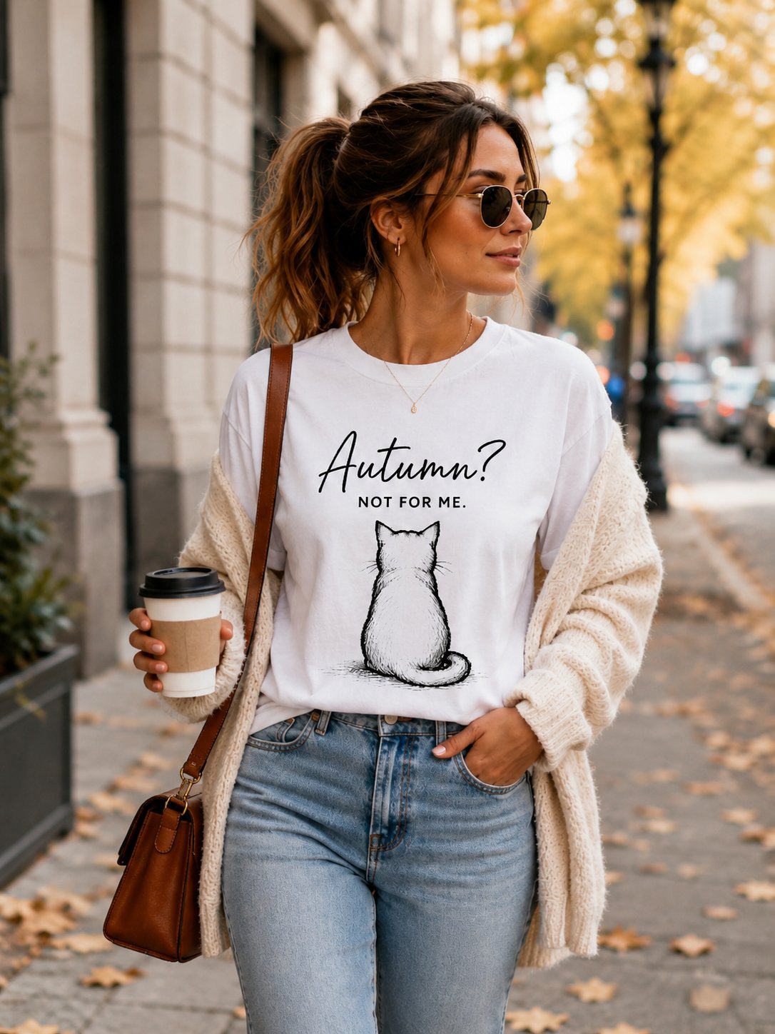 Autumn Not For Me t-shirt worn with a cardigan and coffee on an autumn street - funny cat tee Toronto