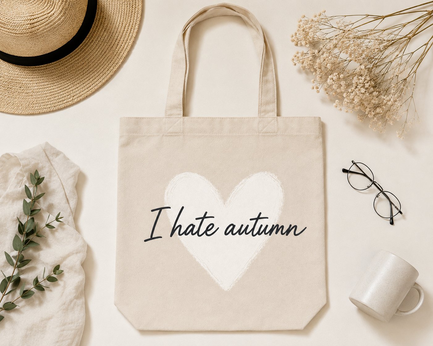 I Hate Autumn canvas tote flat lay with a straw hat and glasses - funny autumn tote