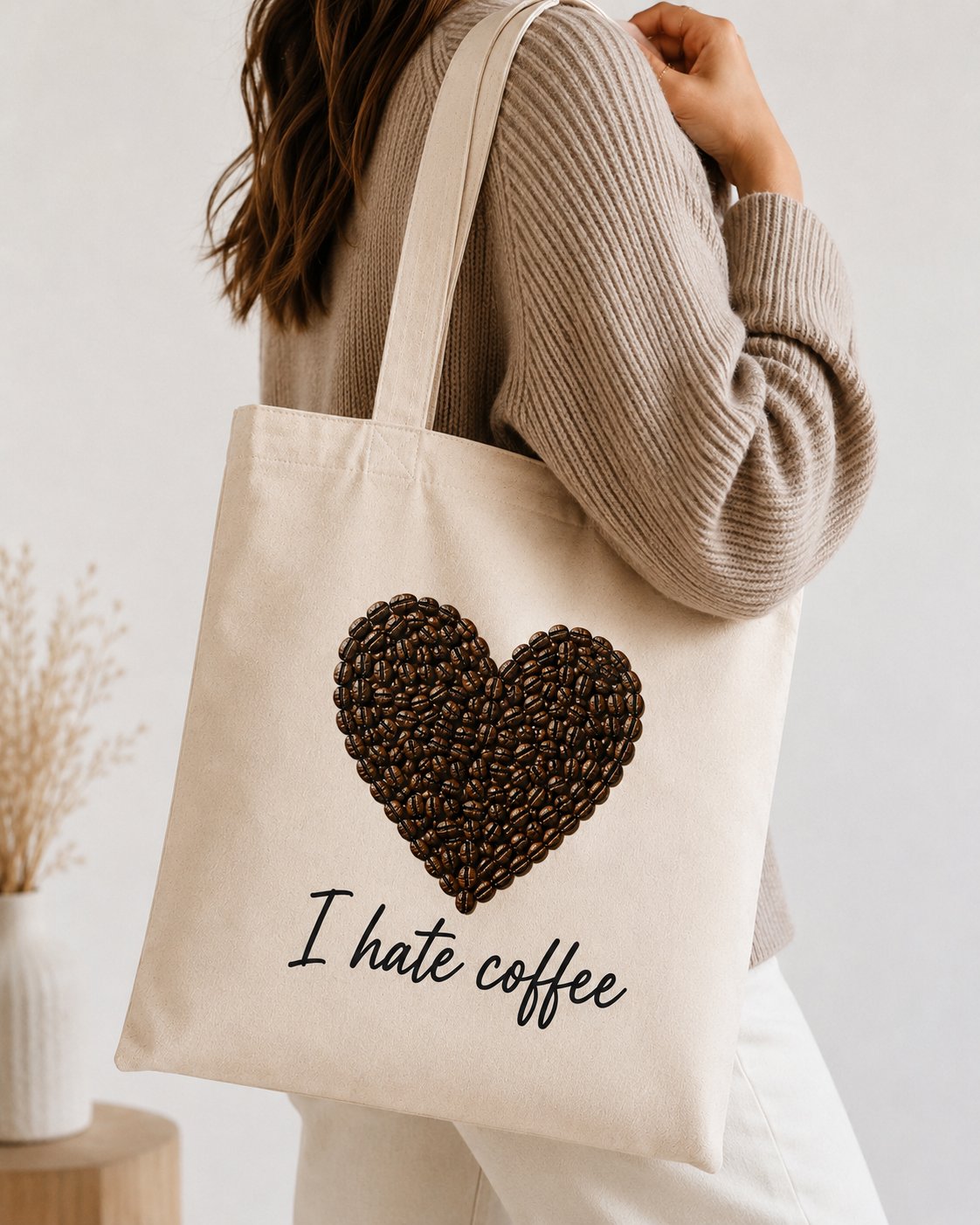 Woman carrying the I Hate Coffee canvas tote - coffee bean heart design - PrintMyVibe Toronto