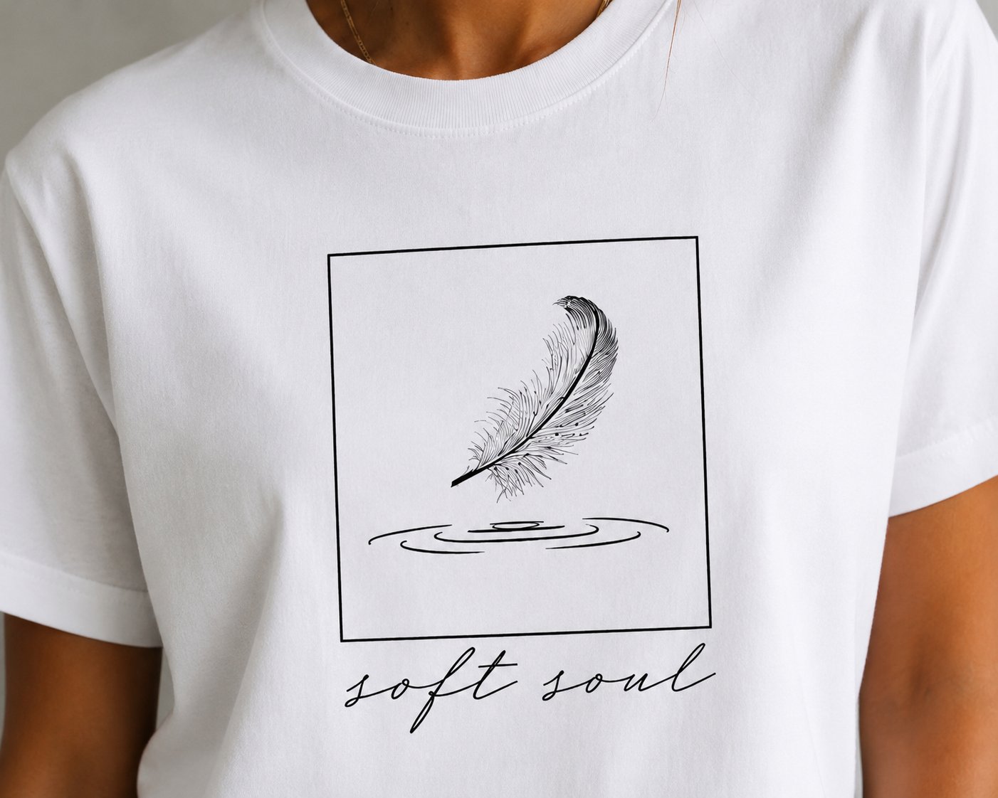 Soft Soul print close-up - framed feather touching water with script lettering
