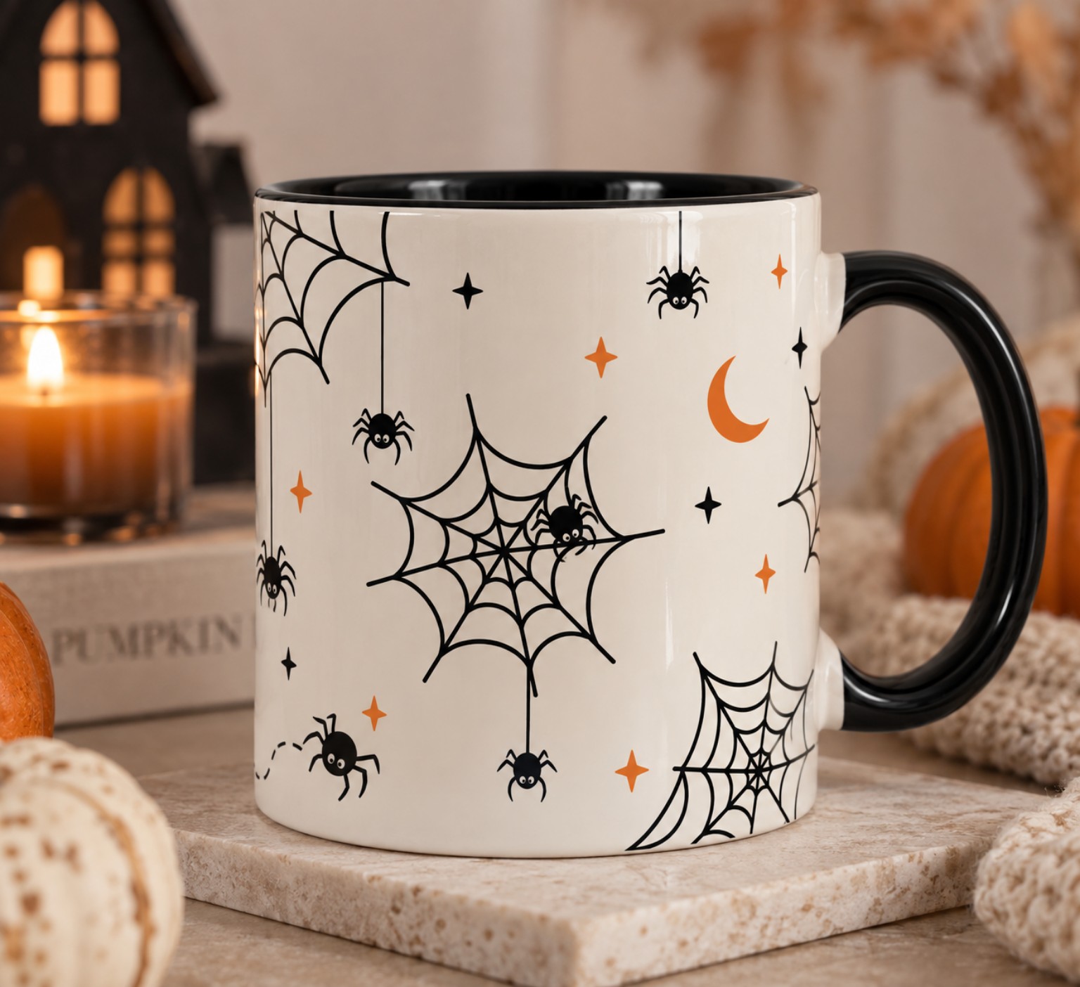 Spiderweb mug beside a candle and pumpkin - autumn Halloween mug Toronto