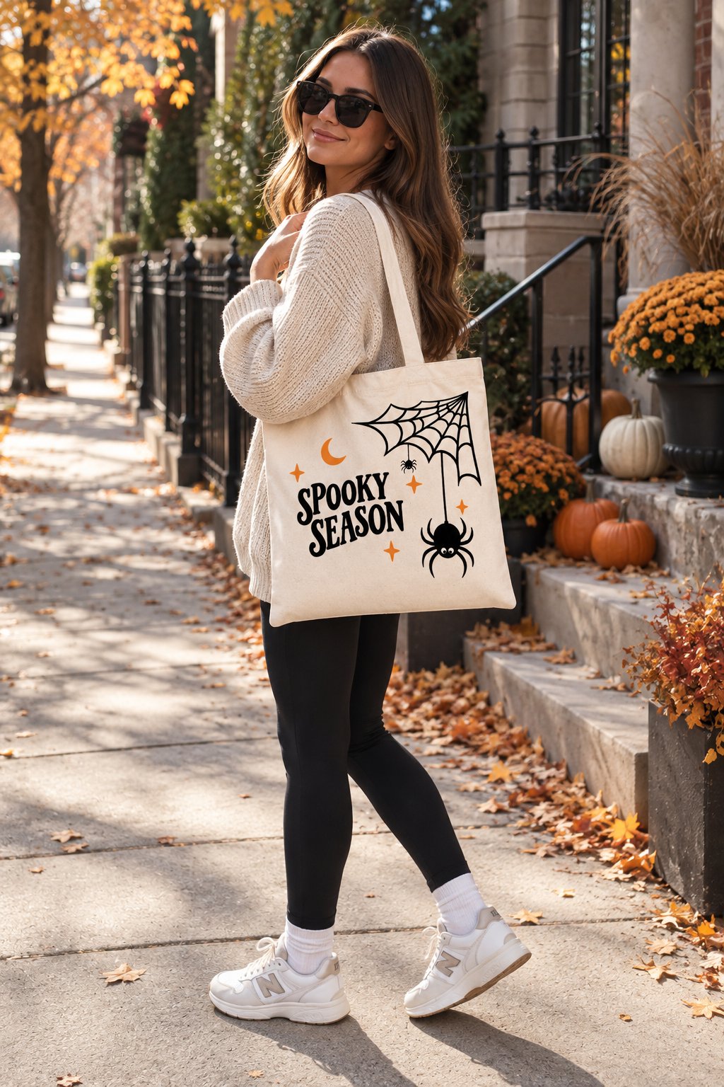 Woman carrying the Spooky Season tote on an autumn street - Halloween tote bag GTA