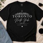 Toronto North York black t-shirt flat lay with jeans, sunglasses and coffee - Toronto skyline tee