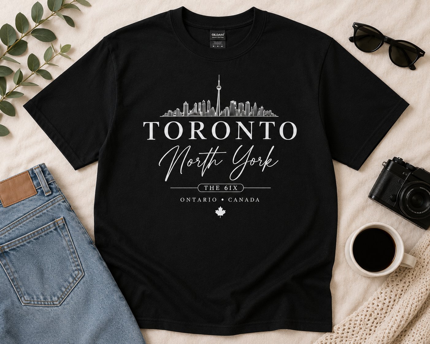 Toronto North York black t-shirt flat lay with jeans, sunglasses and coffee - Toronto skyline tee