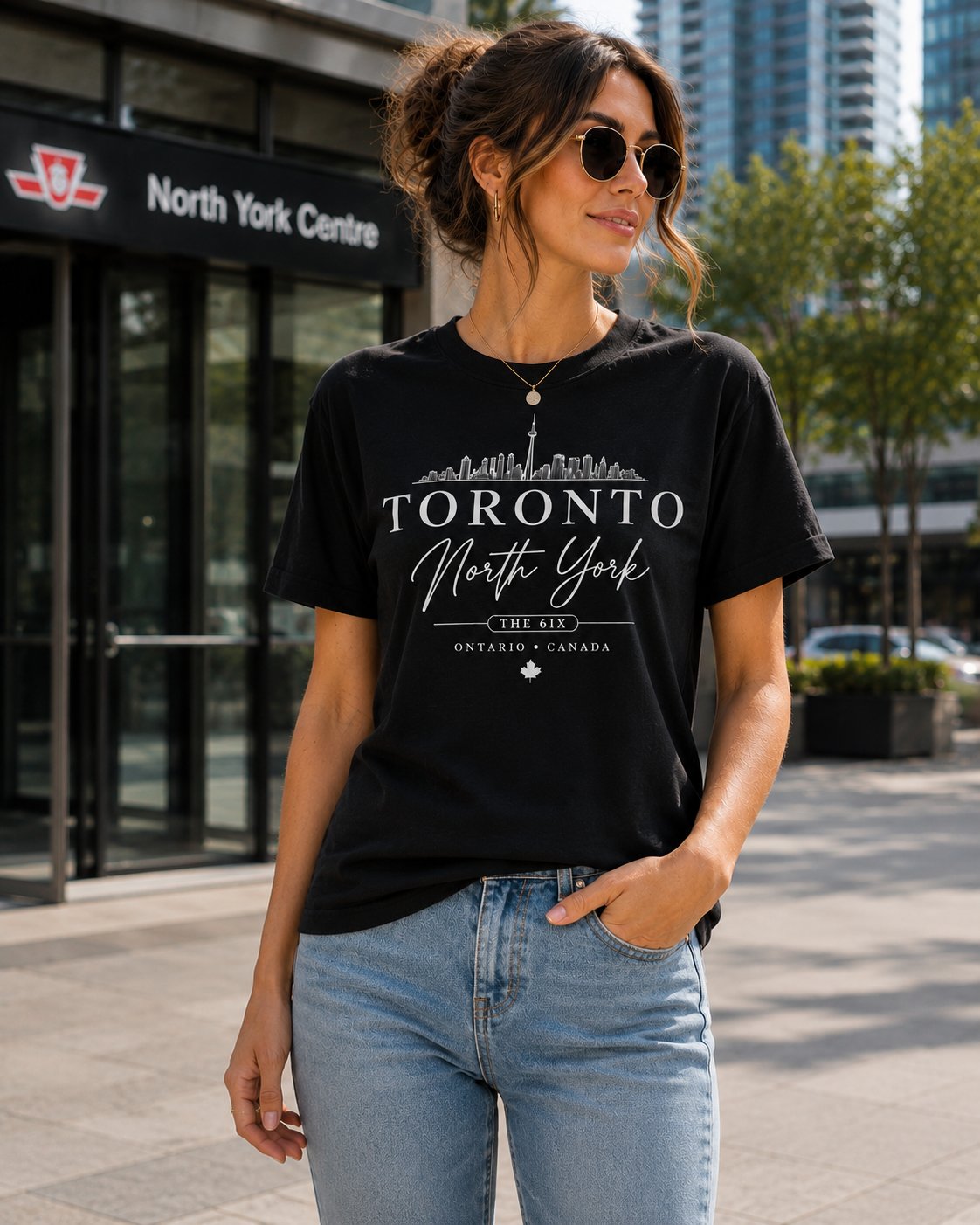 Woman wearing the Toronto North York black t-shirt outside North York Centre - the 6ix skyline tee - PrintMyVibe Toronto