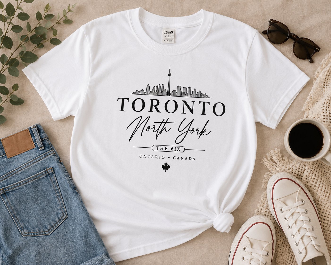 Toronto North York white t-shirt flat lay with jeans, sunglasses and sneakers - Toronto skyline tee