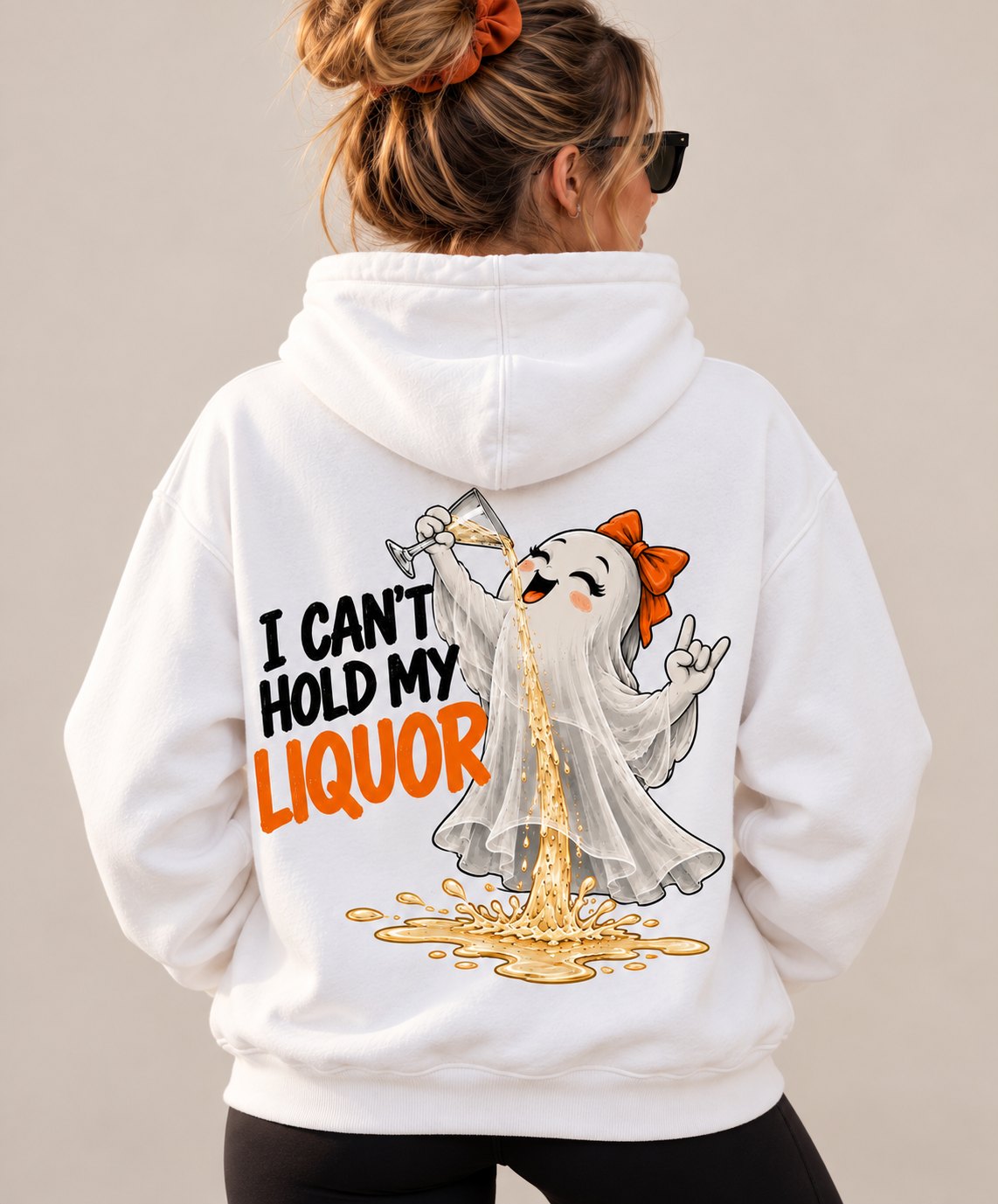Woman wearing the white I Can't Hold My Liquor hoodie, back view - funny ghost Halloween hoodie - PrintMyVibe Toronto