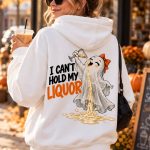 White ghost Halloween hoodie worn on an autumn street with an iced coffee - funny drinking hoodie Toronto