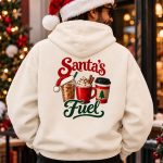 Man in a Santa hat wearing the cream Santa's Fuel hoodie, back view - Christmas coffee hoodie - PrintMyVibe Toronto