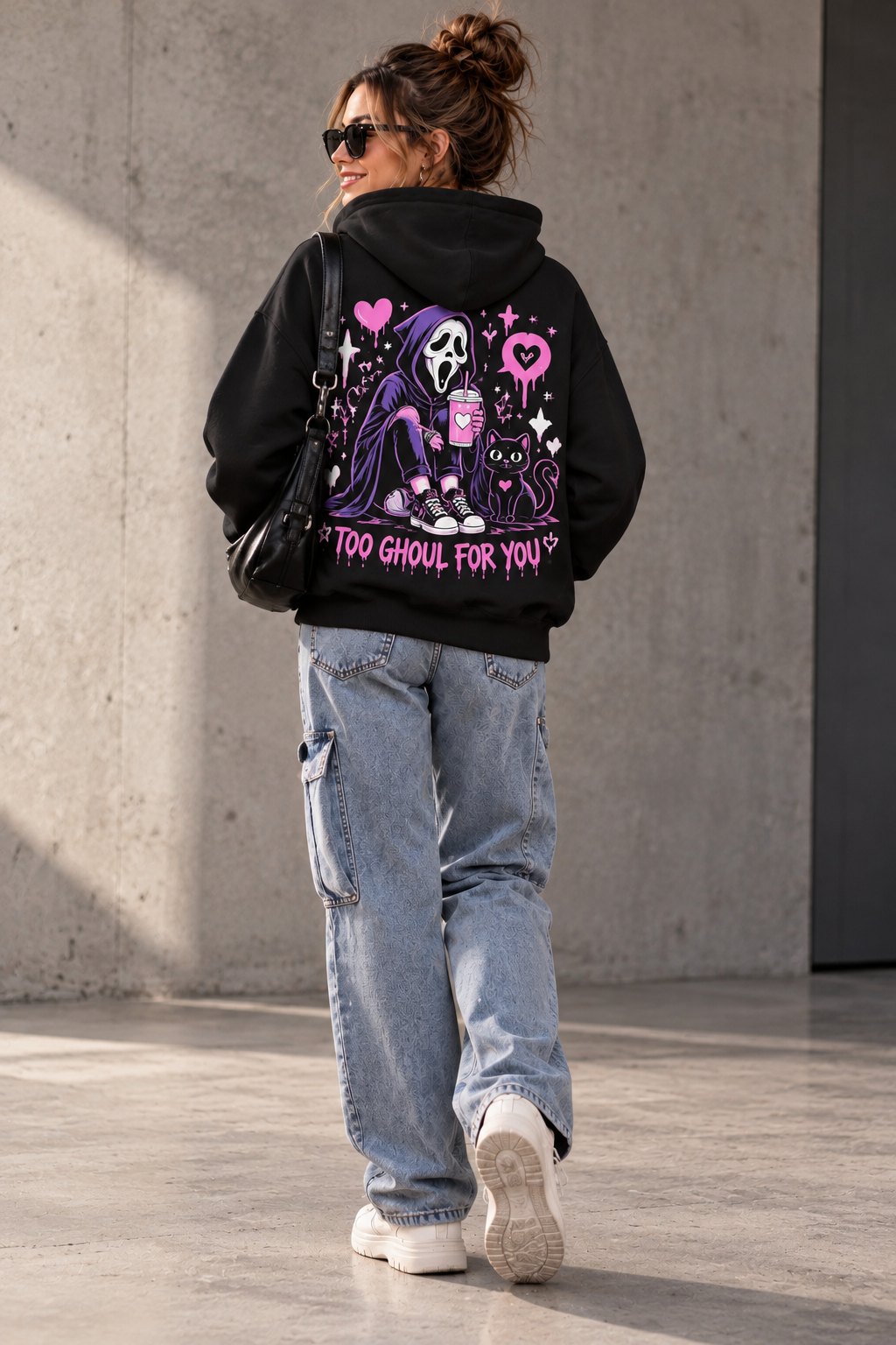 Back of the Too Ghoul For You hoodie worn with jeans outdoors - pink ghost back print hoodie